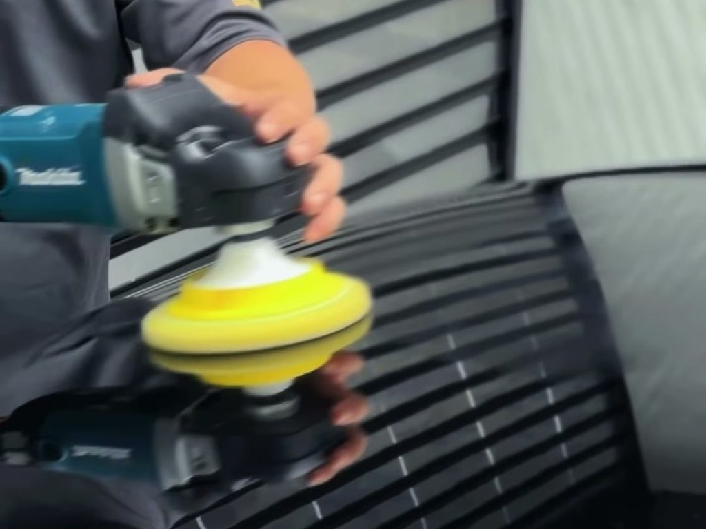 Machine polishing the hood